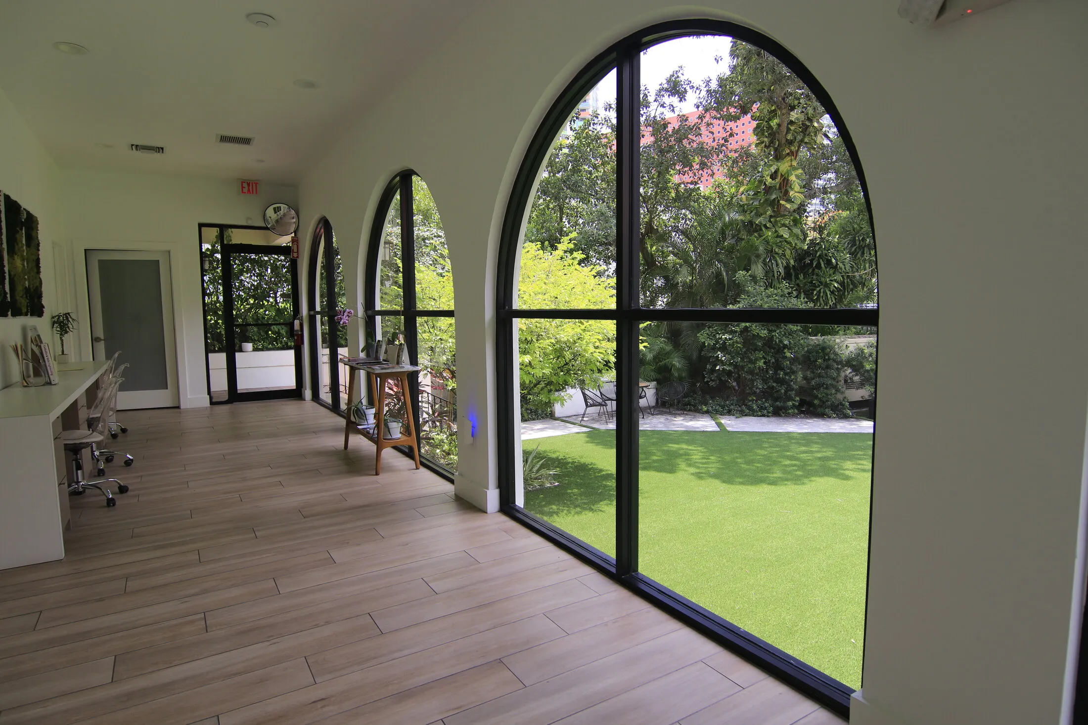 Arched interior corridor with a garden view at Miami Skin Spa in Brickell, Miami