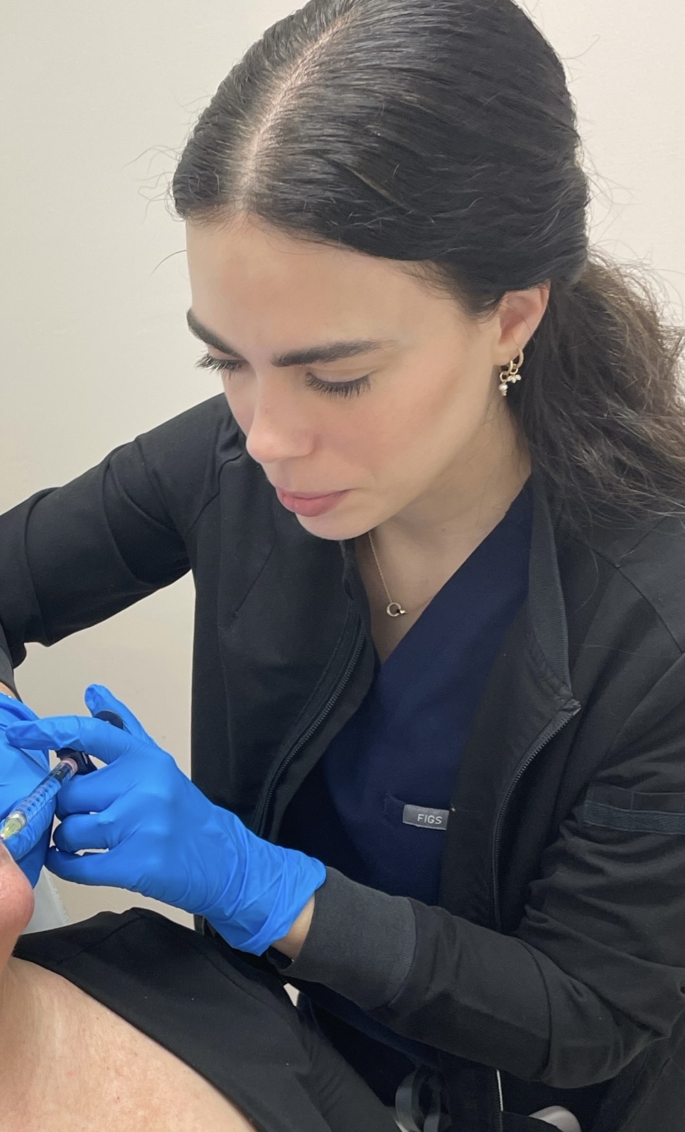Mariana Tolosa, PA-C performing an injectable treatment for a patient at Miami Skin Spa in Brickell, Miami