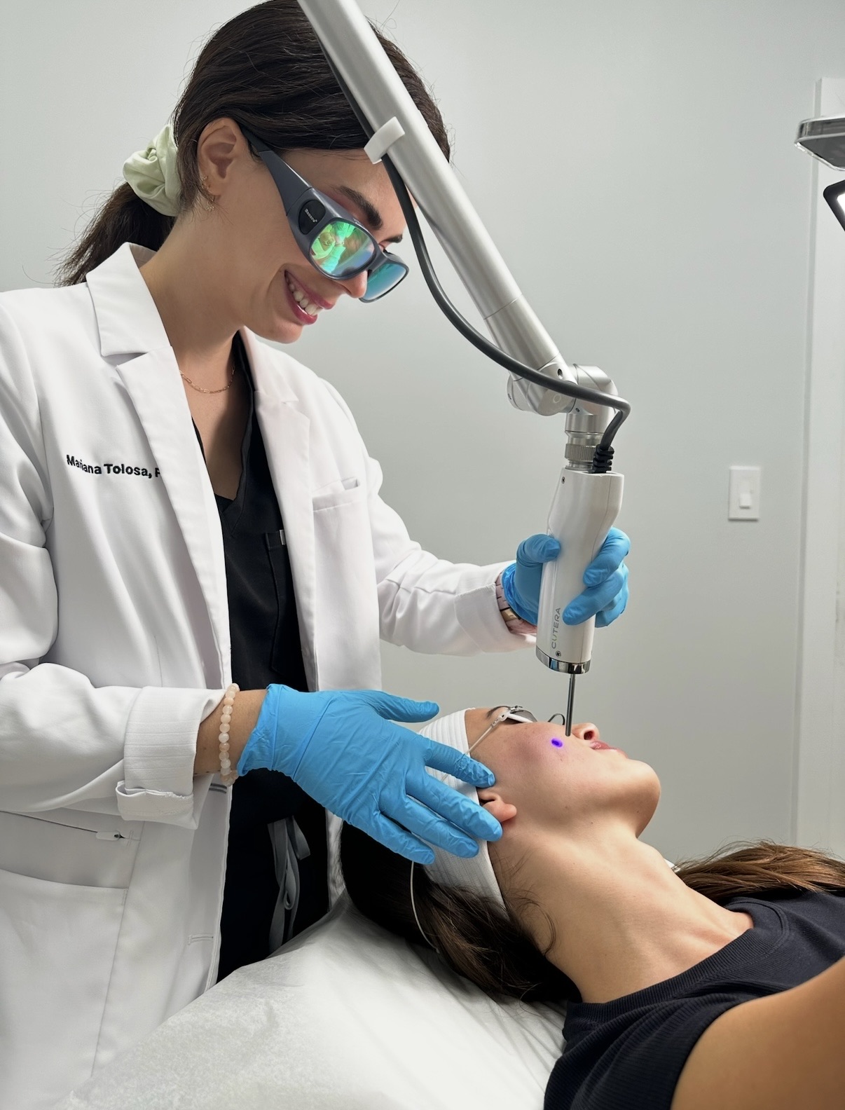 Mariana Tolosa performing a facial laser treatment at Miami Skin Spa in Brickell.