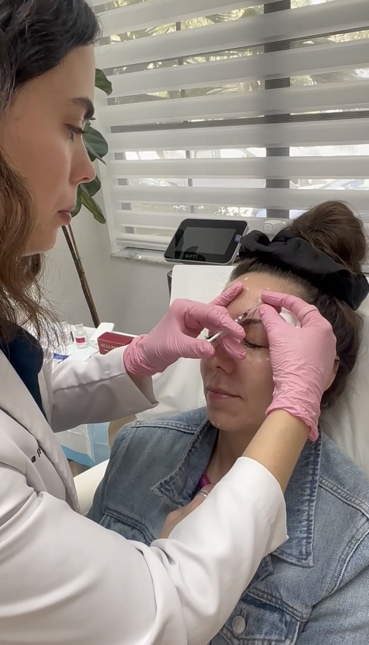 Provider administering a wrinkle-relaxer injection to the upper face at Miami Skin Spa in Brickell, Miami